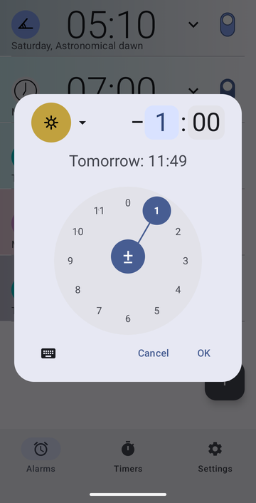 Risetime's create-alarm dialog open over the alarm list: the Noon anchor chip, an offset of minus 1 hour and 00 minutes, and the line Tomorrow: 11:49. A circular minutes dial with 00 selected fills the lower half, with Cancel and OK beneath it.